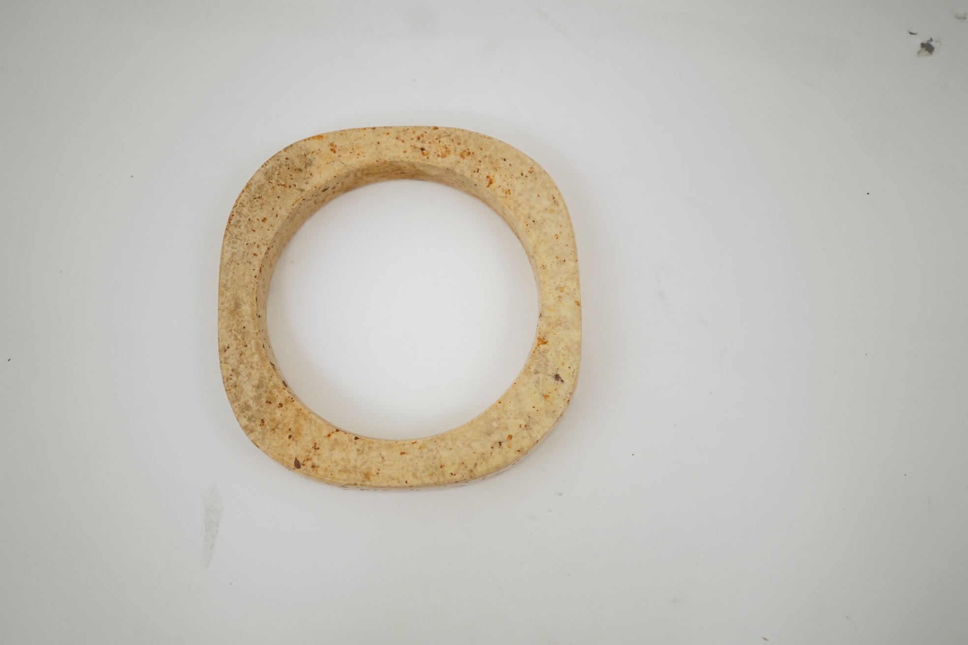 Four Chinese archaistic hardstone or burnt jade cong or cylinders